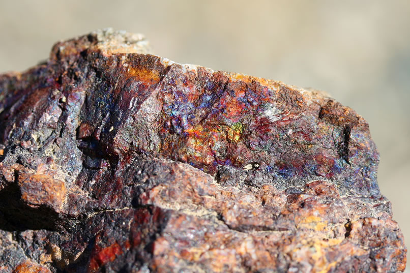 As we climb up the tailings pile, we notice that many of the rocks have an iridescent sheen that looks a lot like chalcopyrite.