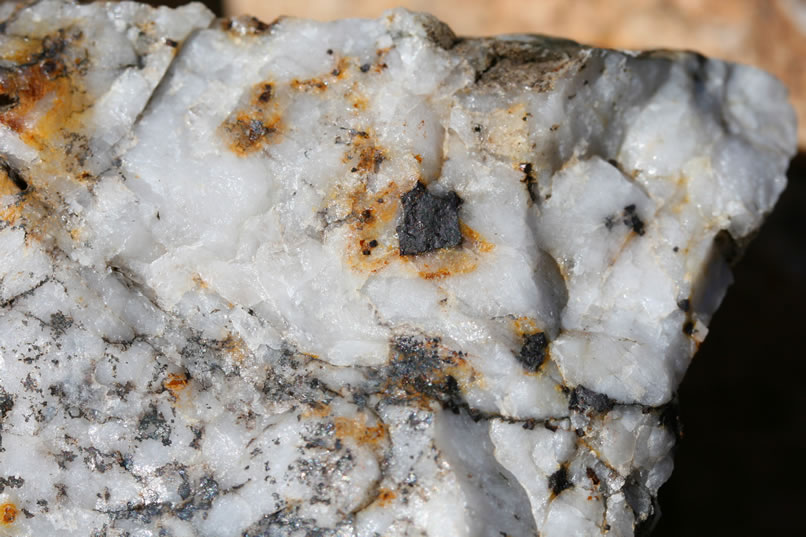 A close-up of one of several pieces of quartz from the tailings pile that have interesting silvery inclusions.