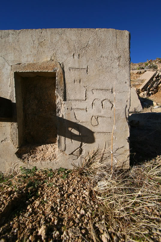 Off to the left is a fallen concrete structure inscribed with the date, April 1, 1931.   This would probably be the date of the mill construction.