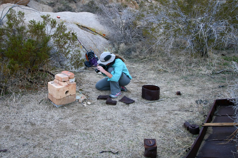 While Niki gets a close up shot of the front, Jamie captures a look at the side.  Notice that the bricks all fit into a shallow metal pan that forms the base for the furnace.