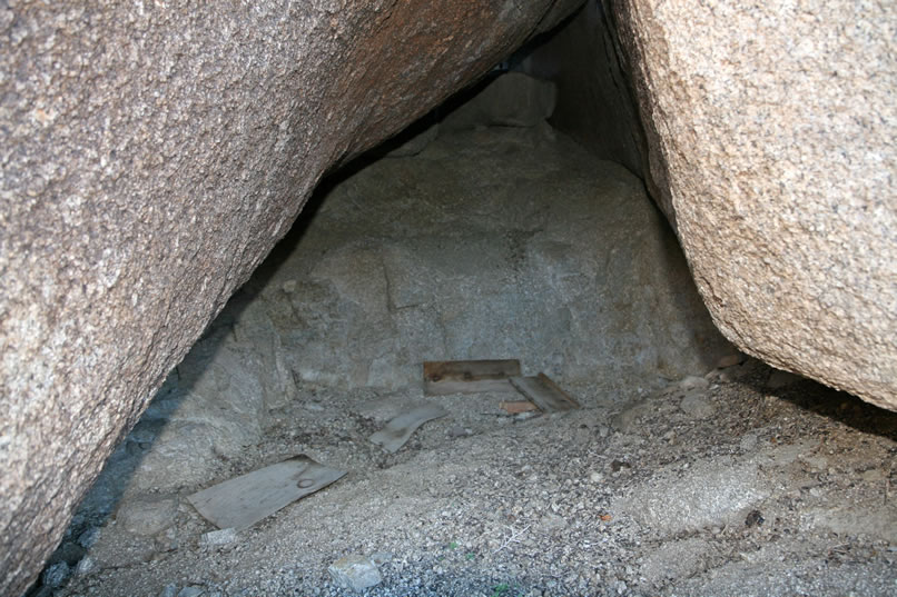 A hollow in a nearby boulder seems to have been used to store wood at one time.