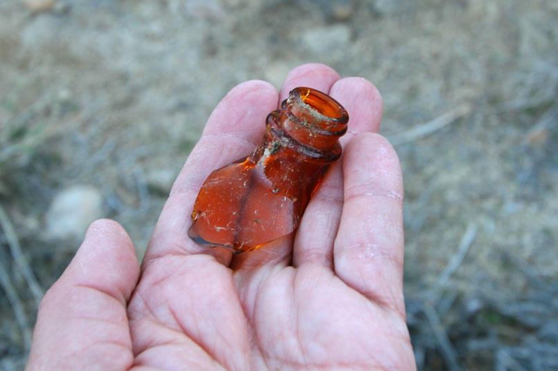 As we hustle toward the wash, we spy a colorful old bottle fragment.