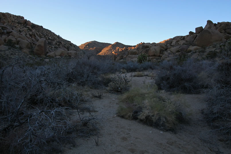 With the ruddy sunset glow frosting the tops of the hills, we concentrate on keeping a fast pace.