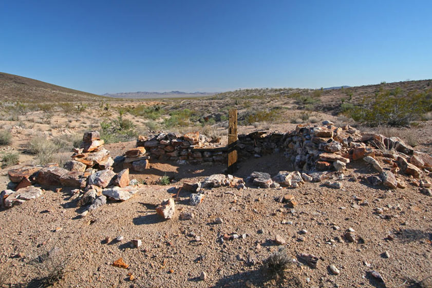 After leaving Goffs, we bump along a two track that takes us into the Southern Piute Mountains to the site of the Leiser Ray Mine.  Our first stop there is to check out this stacked stone foundation.