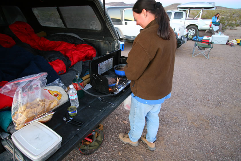 Alysia wins the cooking competition!  Well, you've probably been waiting to find out about the haunted campsite.  Now would be a good time.  Picture us all sitting around the campfire having dinner.  Now imagine the effect that a noise sounding exactly like the slamming of a car door would have as it breaks the silence!  It comes from over by the Lizardmobile, but all its doors are closed and locked.  We prowl around in the dusk looking for footprints and scratching our heads.  Later, as the fire dies, once again the same sound rips through the peaceful night!  We jump up with flashlights blazing and fan out to scan the area.  Again, we find nothing!