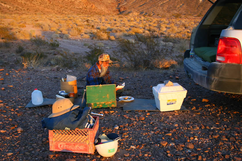 Howard works on dinner as the sun calls it a day.