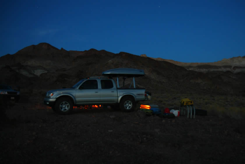 In this long exposure photo you can see the reddish glow from the campfire which is on the far side of the Lizardmobile.