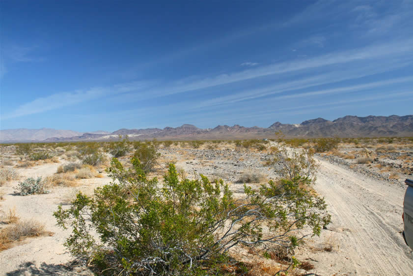 We've stopped just before reaching the highway to take a look back toward the seldom visited remains of the Golden Cycle.  Not only did we find evidence of the mining operations there, but we also discovered a beautiful remote area.  We want to thank Howard for being such a great traveling companion once again.  And thanks to you guys for tagging along on this cyber version of the trip.  Hope you didn't bend any legs on your computer chair on that rough section of road!  See you next time!