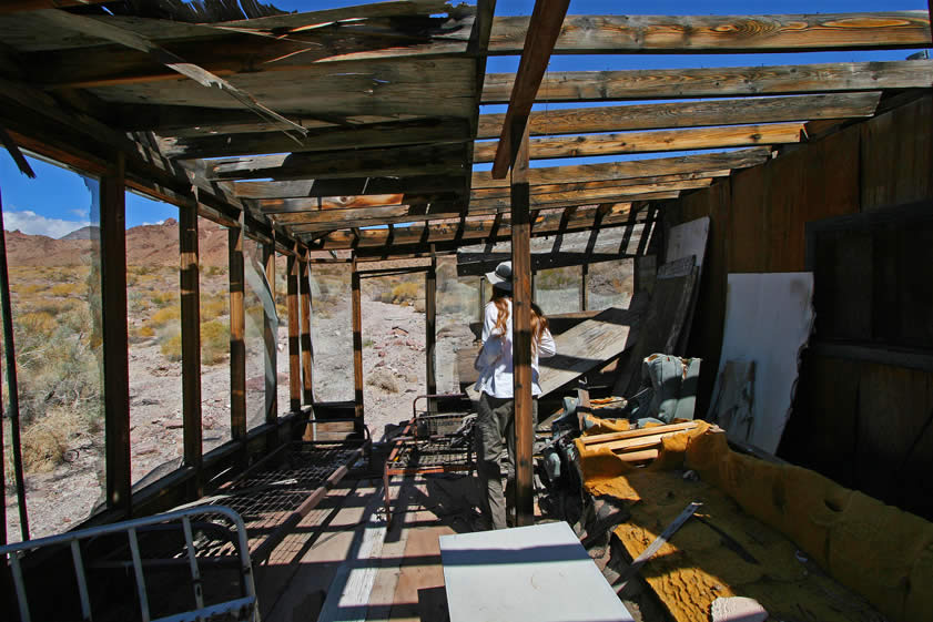 The screened porch is the first room that catches our eye as we enter the cabin itself.