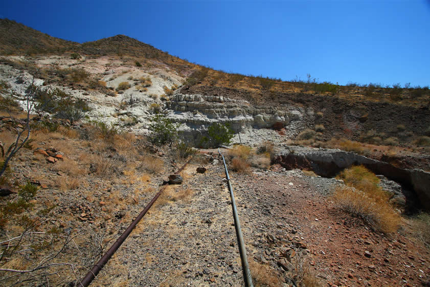 We continue to follow the pipeline as it bends around the hill for a quarter of a mile or so before it ends directly ahead.