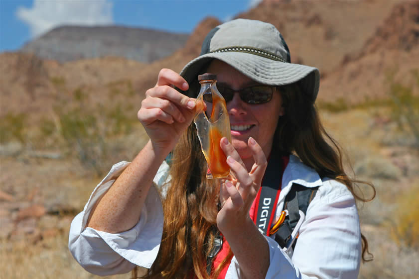 Niki pieces together an old bottle.