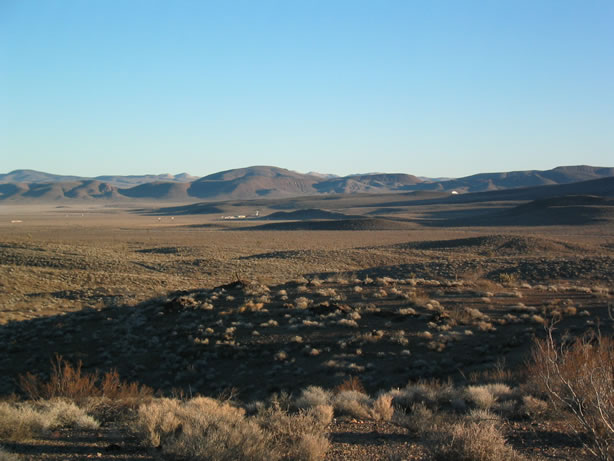 One of the big dish antennas can be seen peeping over the ridge.