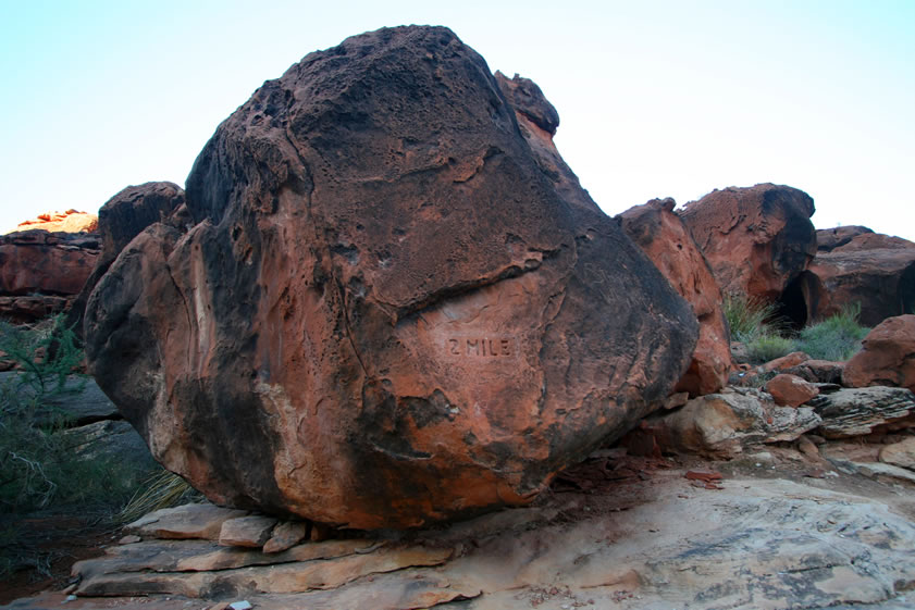 Before we know it we come to this boulder whose carving tells us that we've covered two miles.  WooHooo!