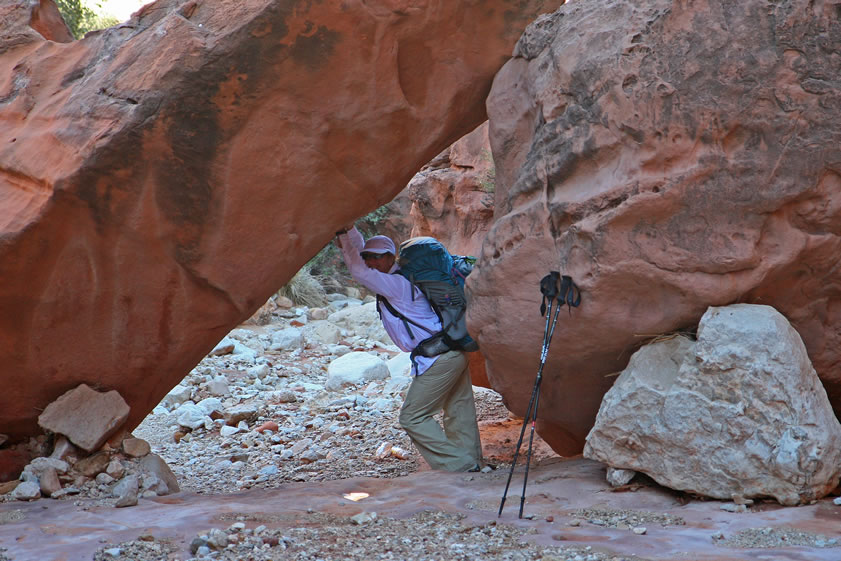 Jenny lifts up a boulder so we can pass underneath.  You rock!