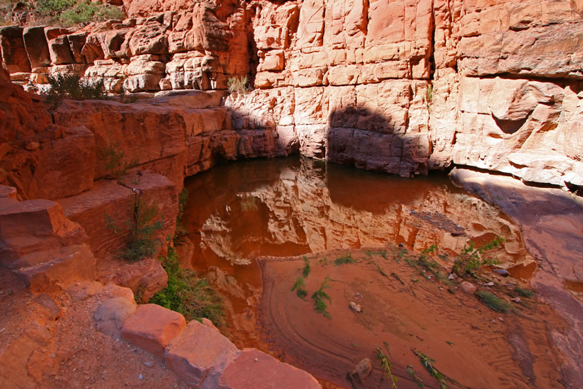 The violent thunderstorms of a couple of days ago have left numerous reflective pools of water in the canyon bottom.
