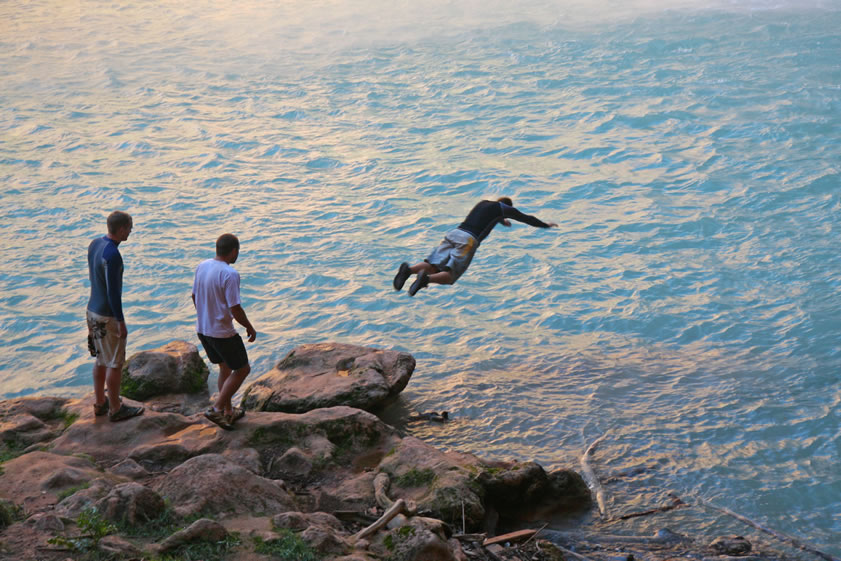 A couple of hikers show off their diving form.