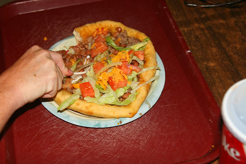 The entree of choice is the Supai taco.  The idea is to take a picture of it in all its glory with the deep fried Indian fry bread, ground beef, beans, lettuce, tomato and grated cheese intact.  Niki can't wait, though!