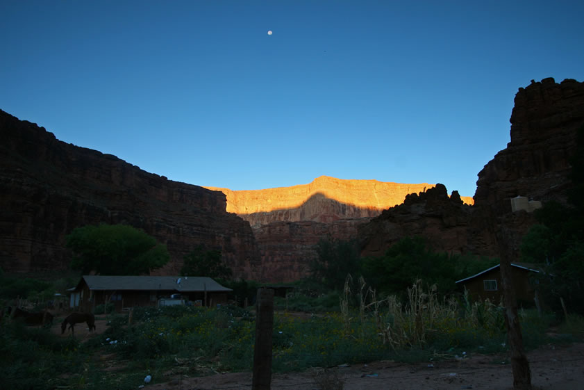 The sun begins to illuminate the higher ridges as we leave the village behind.