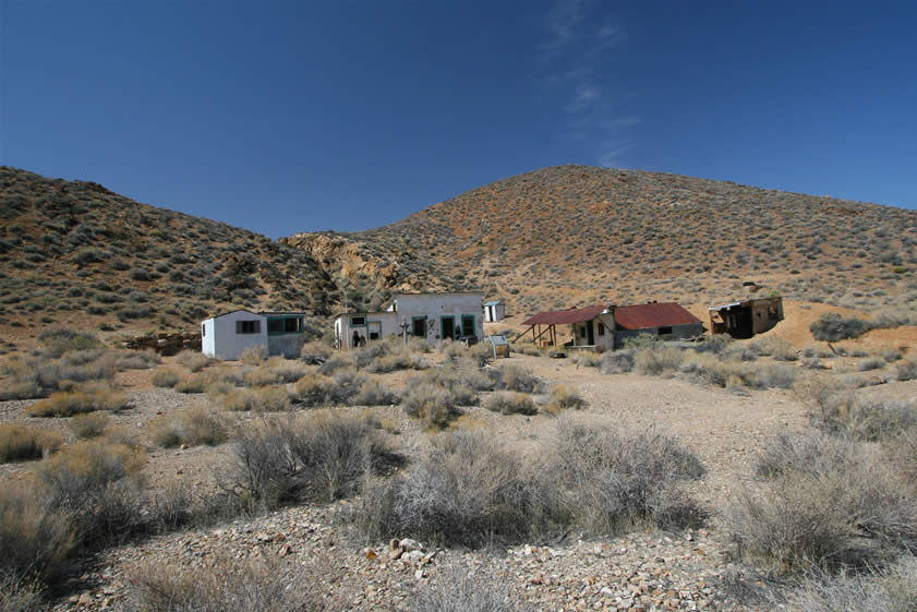 After a few more miles we're able to turn off on the dirt access road toward the Harrisburg area.  This photo is a view of Aguereberry Camp.  Shorty Harris and Pete Aguereberry discovered gold in 1905 at what would come to be called Harrisburg. Soon after that, Pete built a cabin here in 1907.  That structure is the one to the far right of the photo.  Pete lived at this site until his death in 1945.  During that time he worked his Eureka claim and even added the central structure in 1941 for use as a guest cabin.  The smaller structure to the left was built in 1946 by Pete's nephew after Pete's death.