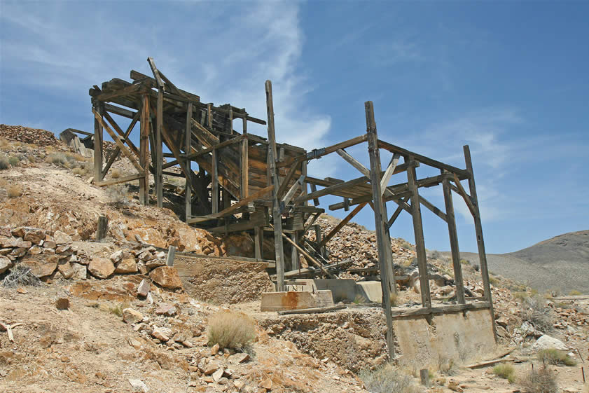 In this view you can see some of the equipment pads.  At one time a five-stamp mill operated as well as a gasoline powered hoisting rig which was brought from the Midas Mine.