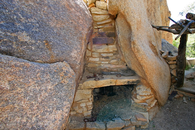  Just before exiting the structure we stop to admire a stone fireplace that's cleverly constructed in a natural opening in the boulders.