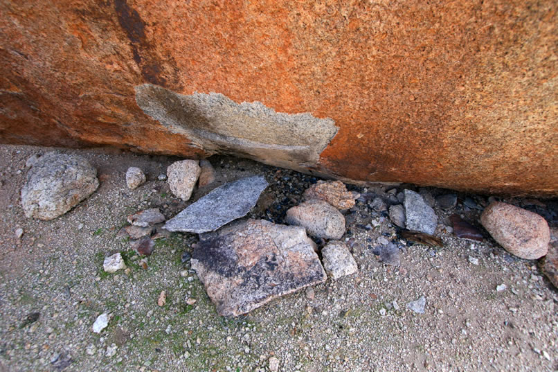 Apparently, as you can see from the charcoal remnants and spalling caused by a hot fire, even modern campers have found this to be a good spot to spend the night.