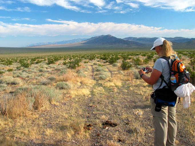 As Jamie photographs a pile of burro poop (she's strange), we can just make out the tiny speck of the truck between us and Lost Lake.