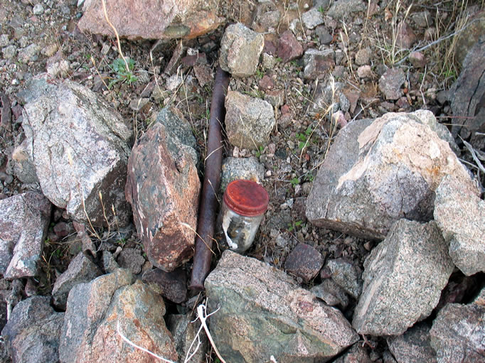 Niki finds a deteriorating claim marker to what we believe is the Burro Lake Prospect.