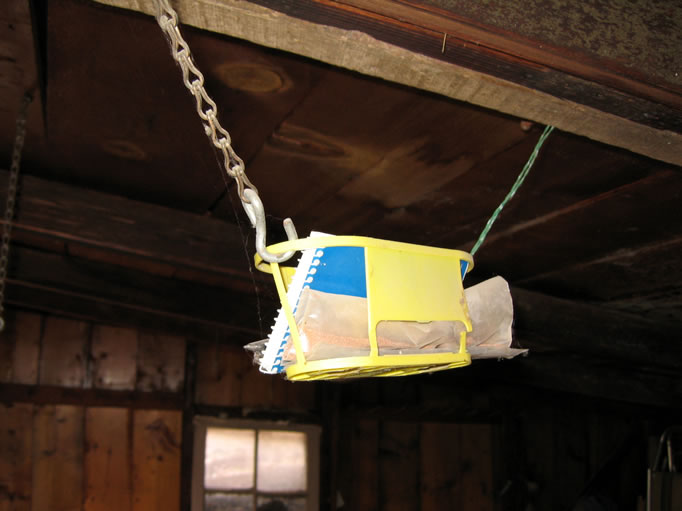 Fortunately, the logbook was found unscathed hanging from a rafter.  Click here to view the logbook entries.