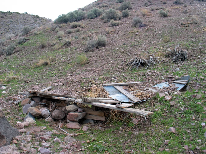 After signing the log and replacing it in its secure location, we extricate ourselves from the cabin and wander over to check out the outhouse ruins.