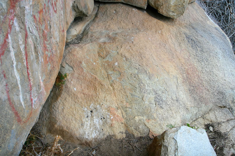 This seemingly untouched rock actually has a very interesting pictograph on it that is so weathered as to be almost invisible.  Please roll your mouse over the image to see the color enhanced version in this and the next two photos.