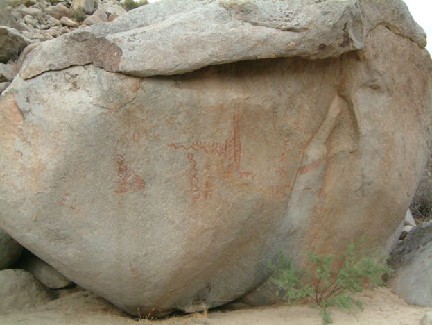 The red pigment and snake symbols are common motifs for puberty rites of Indian girls.