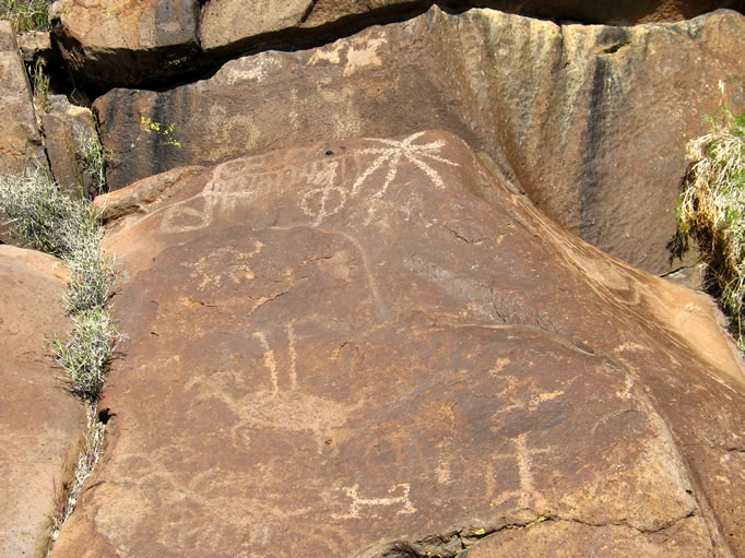 Notice the bighorn impaled by two arrow or atlatl shafts.