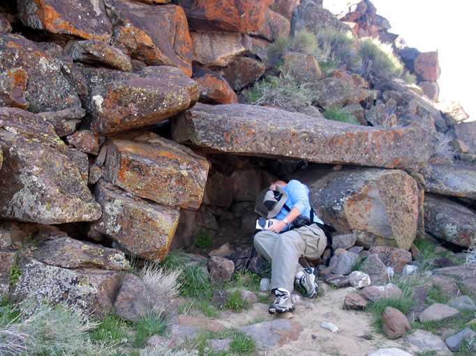 Niki checks out a vision quest structure.