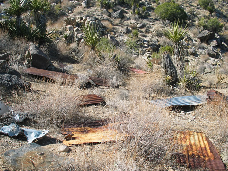 Most of the cabin roof seems to have ended up at the bottom of the nearby ravine.