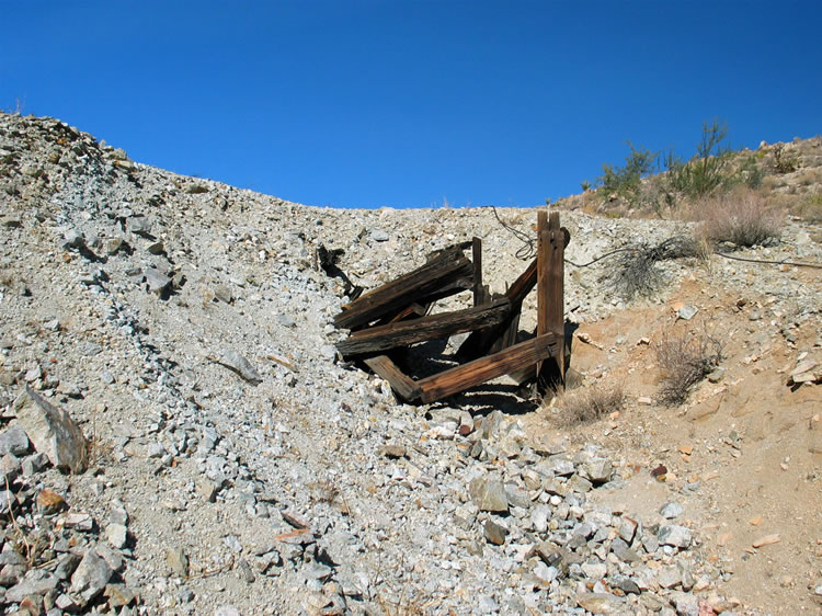 We get ready to scramble up the tailings pile to see what's up above the tunnel.