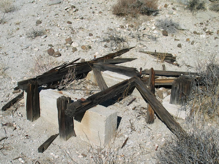 Finally, there's a concrete and wood foundation with large bolts that probably held machinery in place.