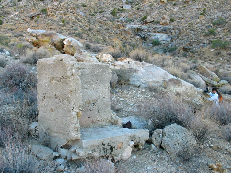 Part of an old structure marks the trail to the tunnel.