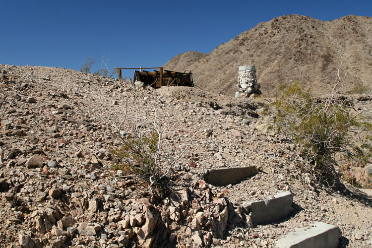 As Jamie descends she takes a photo of the old steps leading from the cabin to the trail.  Howard, who appears to be half bighorn sheep, sets off on a gnarly scramble which drops him into the wash from a different direction.