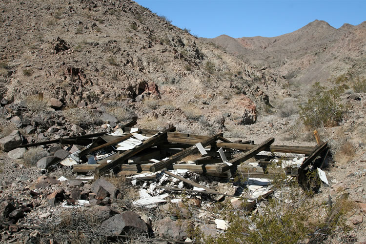 Nearby is all that remains of a mine building.