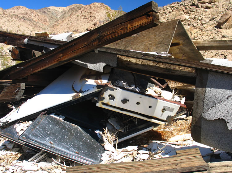 A crushed gas stove.  We're intrigued and wonder what they were mining.  This means a scramble up the hillside to see what was going on up there.