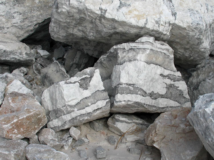 Nearby is some of the "zebra rock" overburden that has been removed to uncover the calcite.