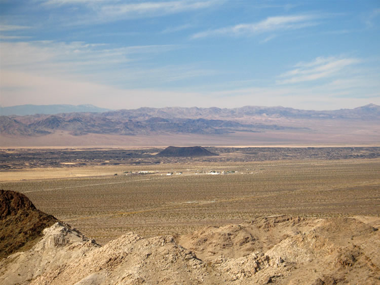 This telephoto view shows not only the crater but also the small desert semi-ghost town of Amboy in the foreground.