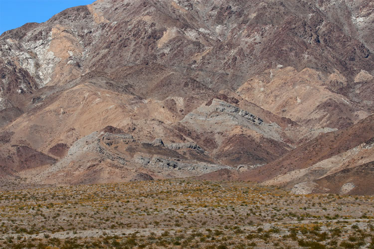 On our way along the highway to Amboy we make a stop to examine some of the extreme folding present in the Bristol Mountains.  Can you spot the u-turn fold at the lower left portion of the photo?