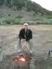 Jamie tending the fire. (76kb)