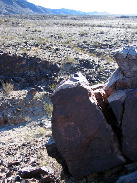 A lone petroglyph high above the others.