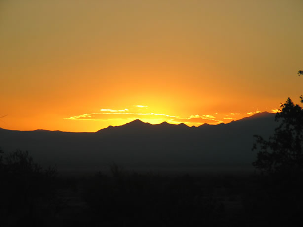 The sun setting over the Palen Mountains.