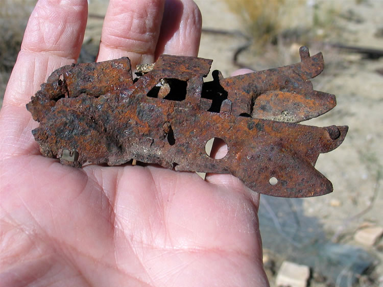 ...and what appears to be the remains of a stamped tin truck toy.  From the look of the fenders it doesn't look modern!