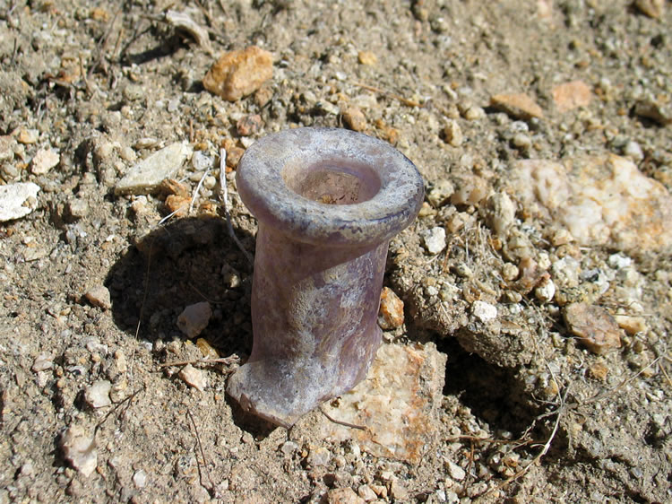 The spout from an old bottle.