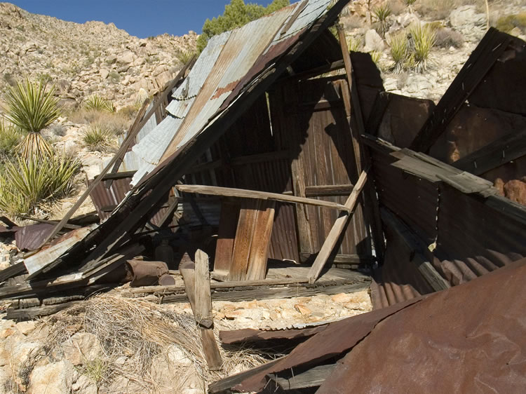 The cabin itself has twisted and collapsed but still contains some neat stuff.